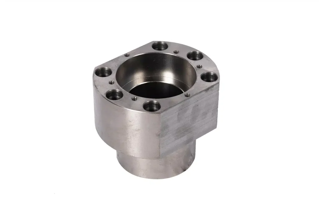 CNC turned flange housing with precision bore and bolt hole pattern