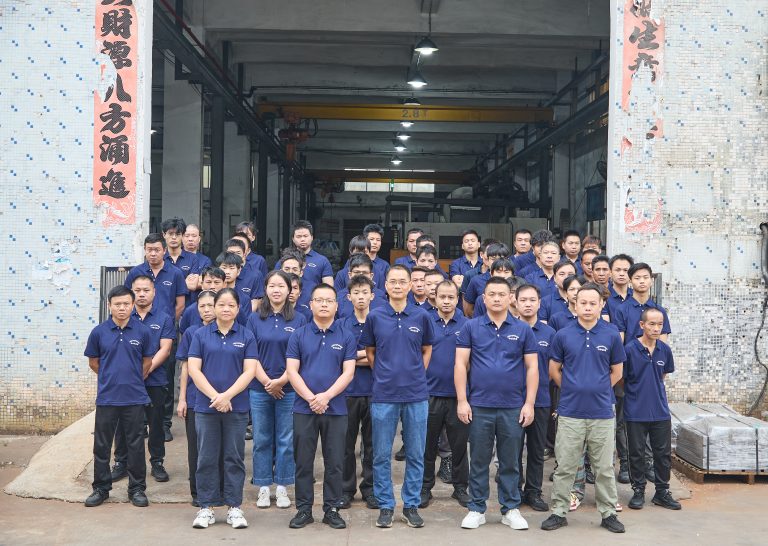 Minhe company team group photo in front of workshop