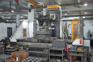 Operator working in the CNC machine production area