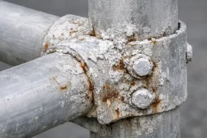 Aluminum structural joint corrosion with white oxide buildup and fastener-related discoloration