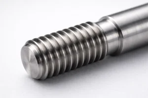External thread machined on a metal shaft, showing clear thread profile and turning marks