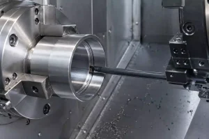 Internal grooving process showing a boring bar cutting an O-ring groove inside a metal bore