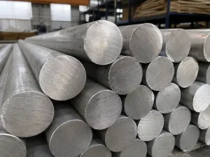 6061 aluminum round bar stock stacked in an industrial warehouse